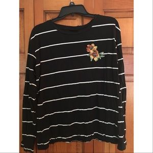 Long sleeve black shirt with white stripes.